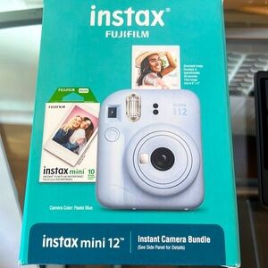 Polaroid camera with film. New in unopened box.